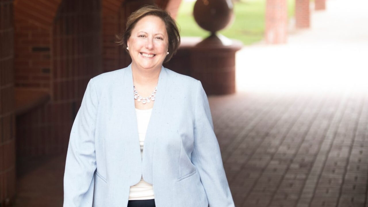 Angela Mattie smiling on campus