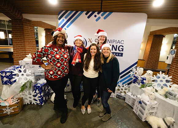 Students take a photo with an administrator.