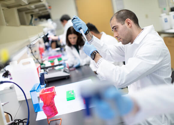 Student conducts an experiment in a research lab.