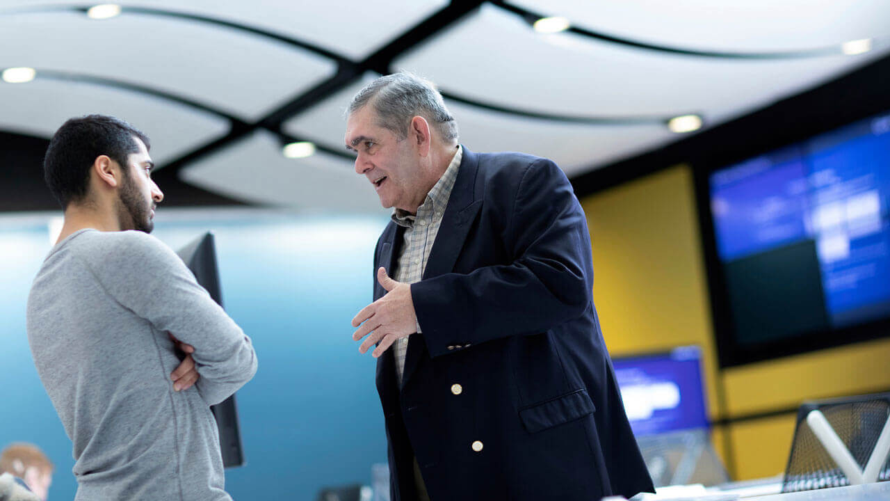 From right, guest speaker Dr. Jose Oro from OROMAX, LLC. speaks with senior Vinay Malhotra ’19, finance, after presenting the ”Alternative Investments Institute Lecture Series” in the Lender School of Business Terry W. Goodwin ’67 Financial Technology Center at the Mount Carmel Campus