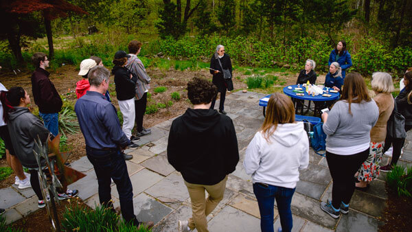 A presentation is given to attendees on Arbor Day at ASI