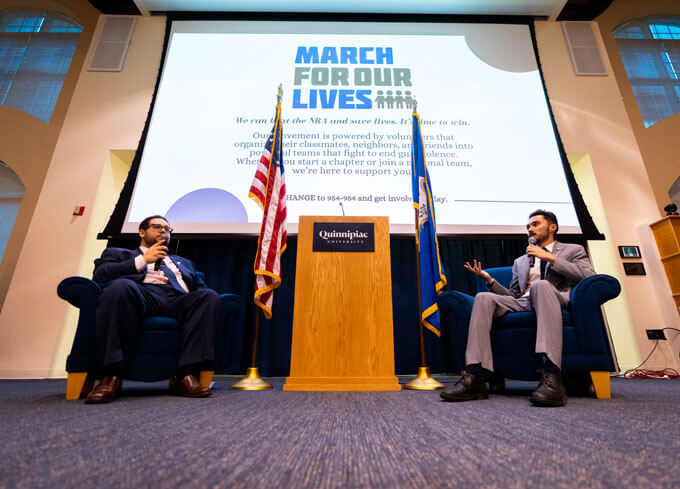 A panel presentation in the Mount Carmel Campus auditorium.