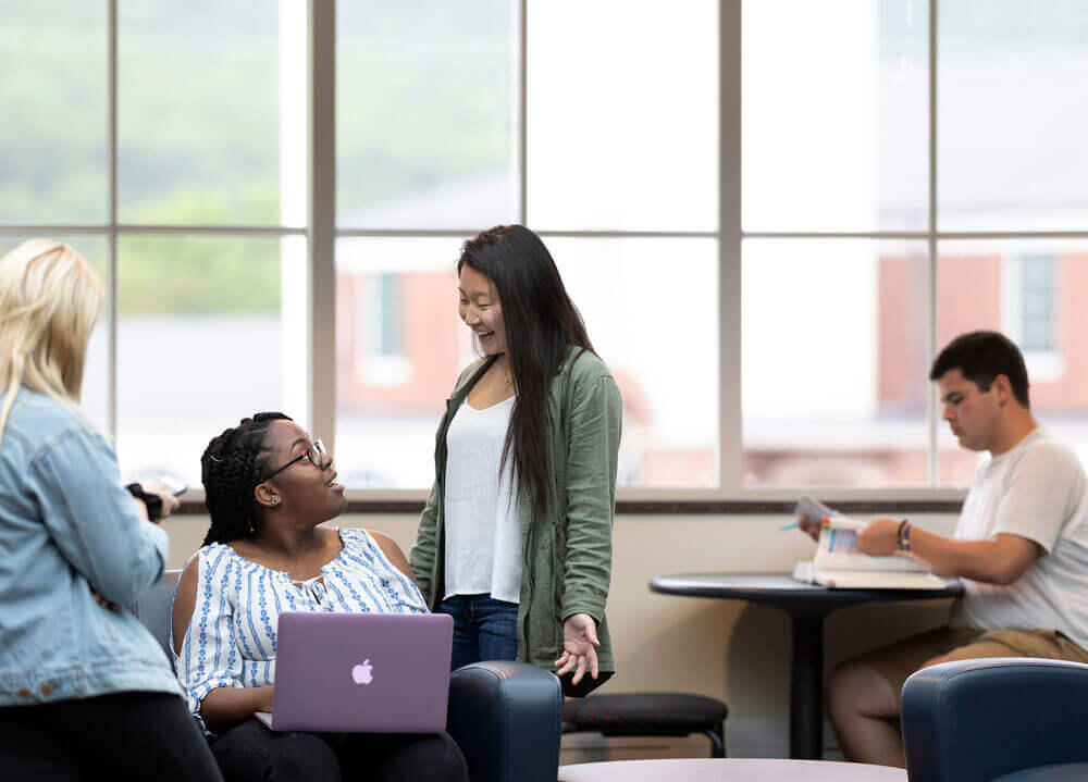 A group of students work together in the Carl Hansen Student Center