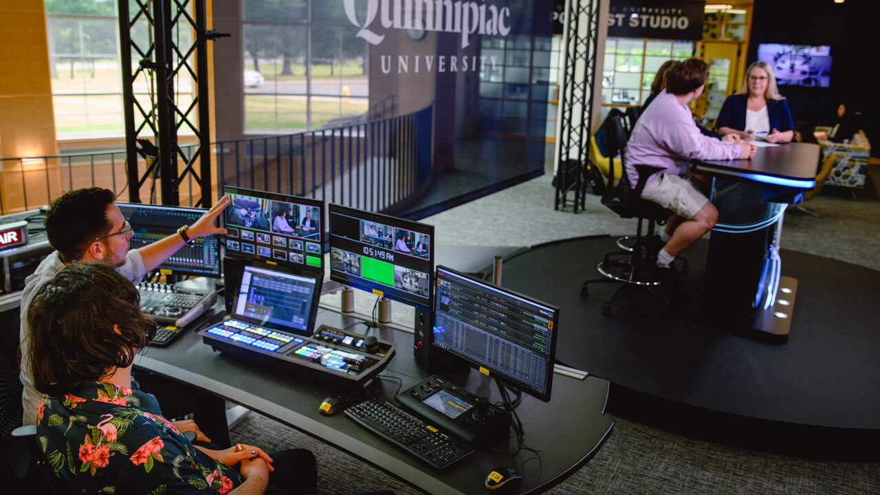 Students working at the recording equipment in the open air studio