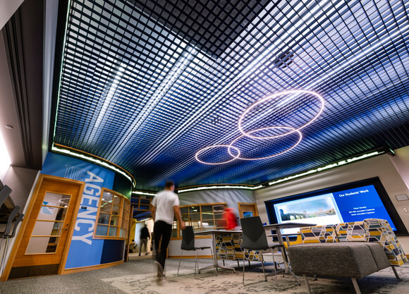 Students walking through the newly renovated School of Communications.