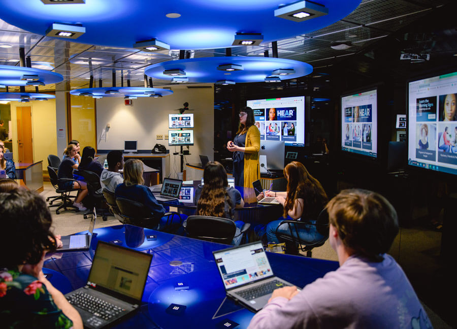 Communications students sit in a classroom during a social media lecture.