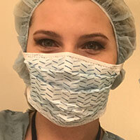 Headshot of Shannon Murray in her scrubs and wearing a face mask