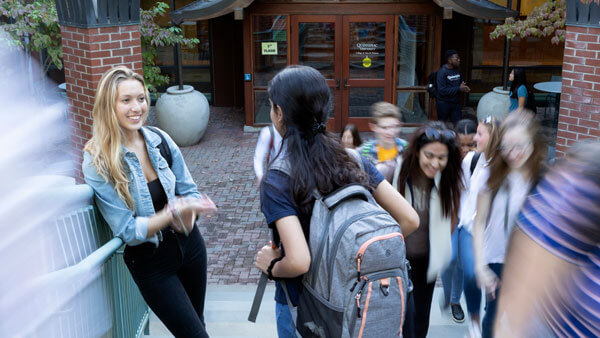 Undergraduate students talk outside the College of Arts and Sciences Center