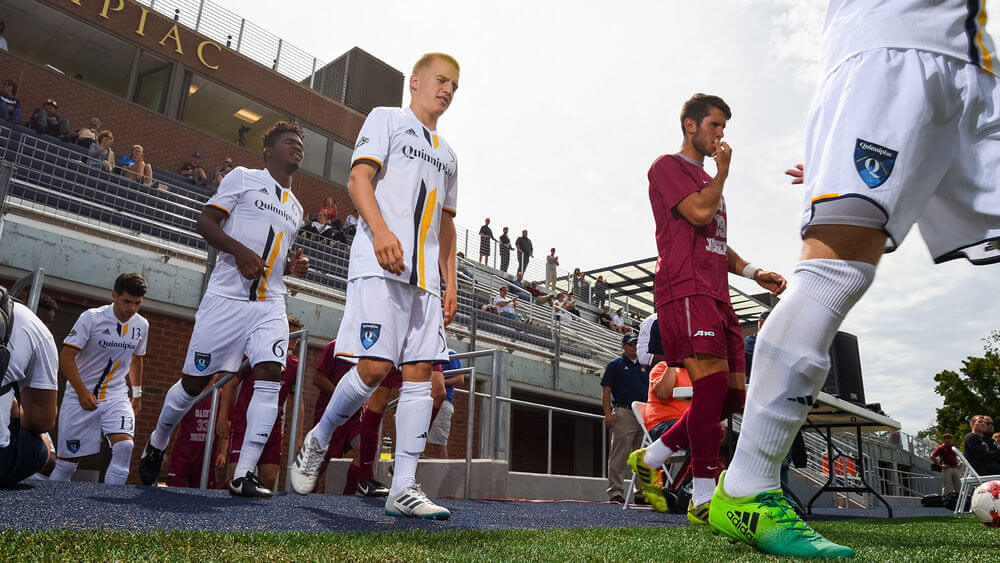 Quinnipiac's Men's Soccer team enters the field of play at the new Quinnipiac Soccer & Lacrosse Stadium on September 2, 2017. The team would cap off the day with a 1-0 regular season home opener win against St. Joseph's.