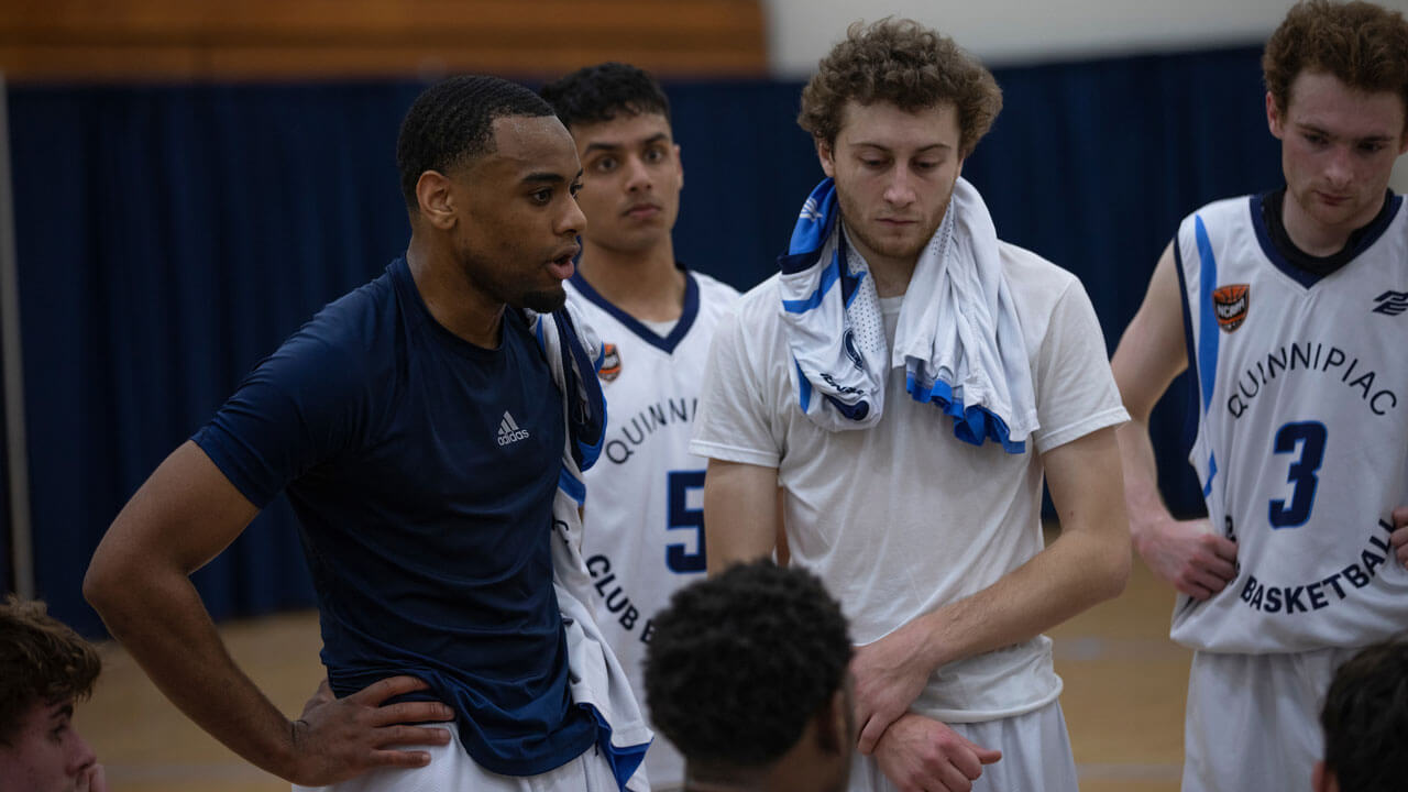 Basketball team discussing game plan