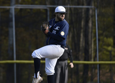 Man pitching baseball