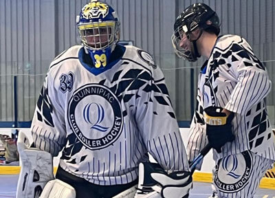 Two men talking in the roller hockey rink