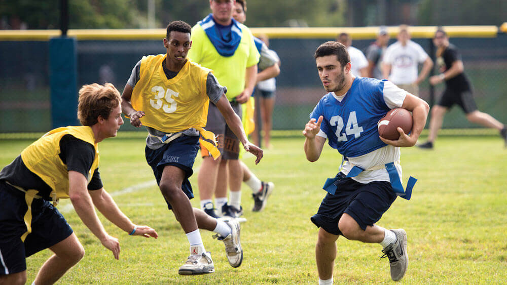 Graduate student Jared Einhorn carries the ball during an intramural flag football game Friday, Sept. 9, 2016 on Quinnipiac's Mount Carmel campus.