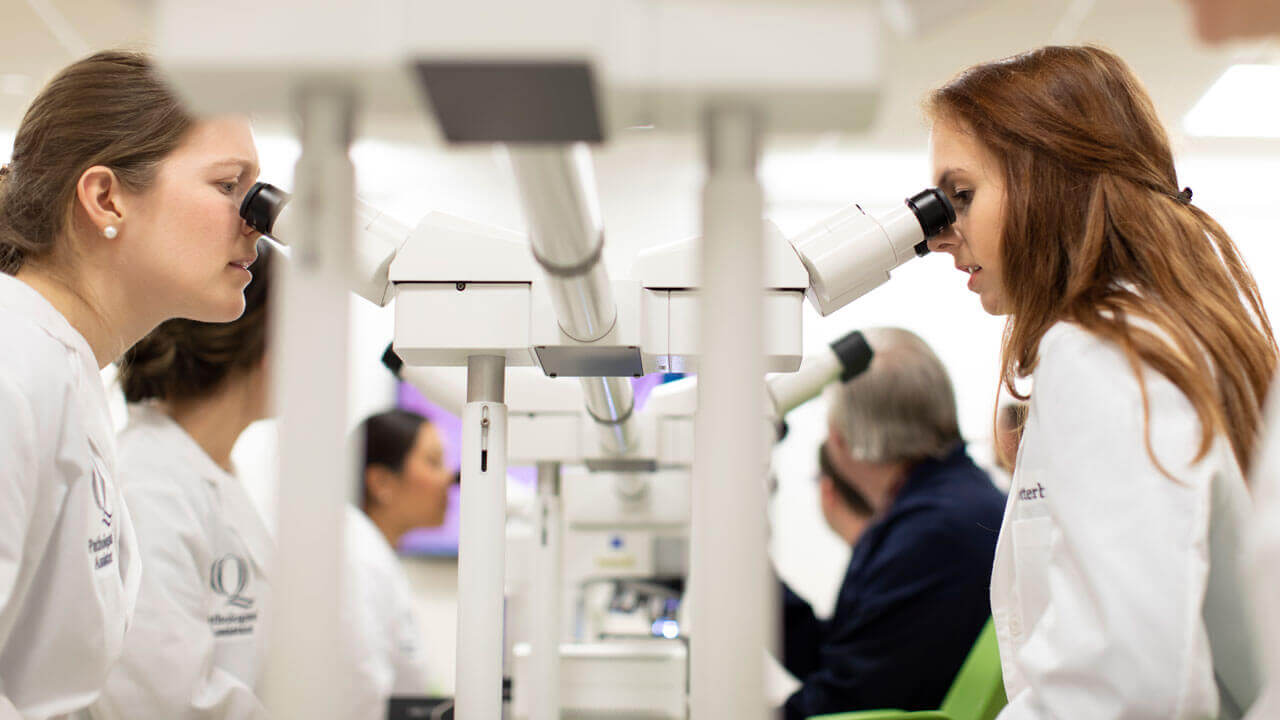 Pathologist students working in the microscope laboratory on the North Haven Campus.