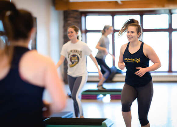 A student leading a yoga session