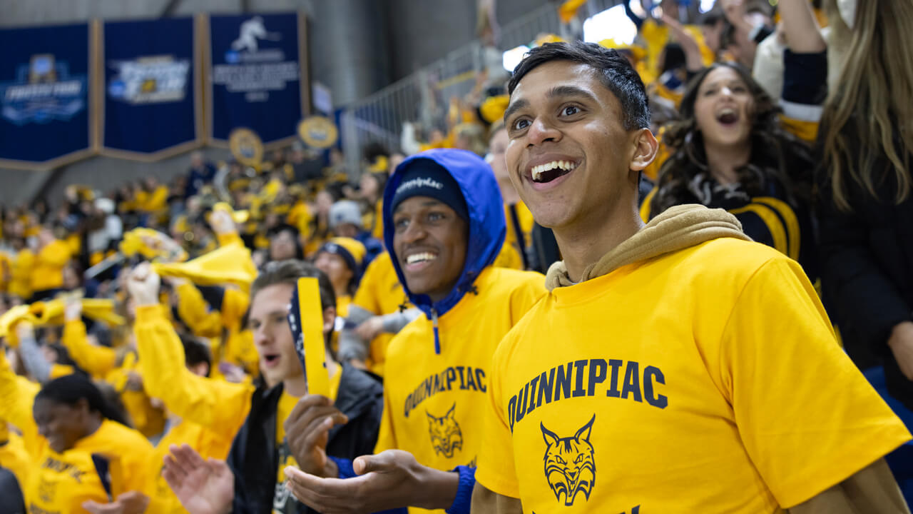 Students cheer on the Bobcats hockey team.