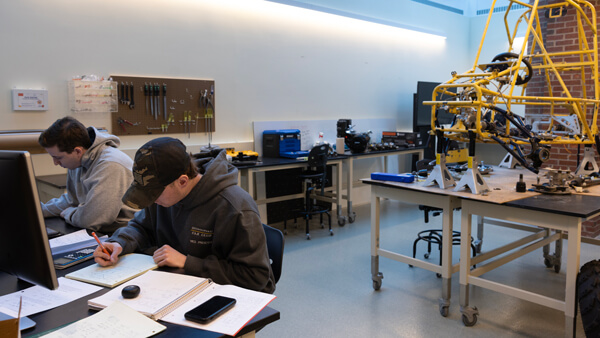 Computing and engineering students work on a project.