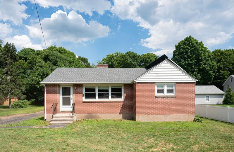 One-story red brick house on 17 New Road