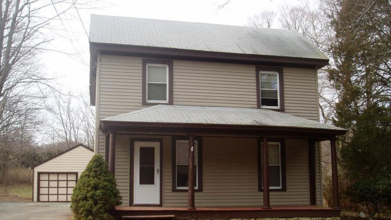 Tan two story house on 192 New Road