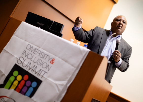 A man lecturing at a podium