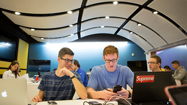 Students work on their laptops