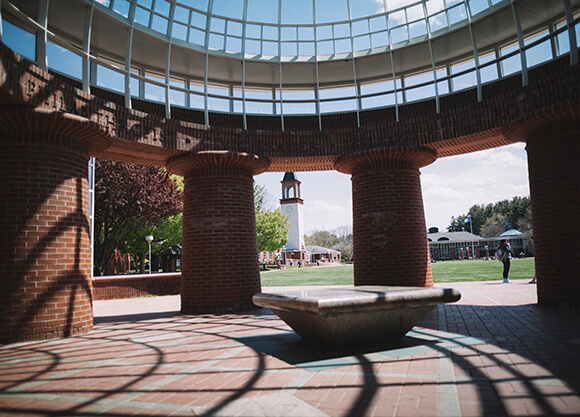 Student passes beneath dome