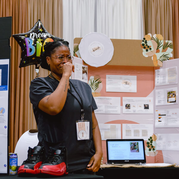 A small business owner shows emotion during the ConnCORP graduation ceremony