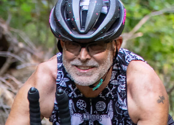 School of Law professor John Thomas rides his bike on the Great Divide Mountain Bike Route.