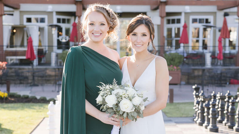 Bridemaids and bride hugging each other