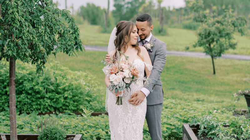 Couple posing in a garden