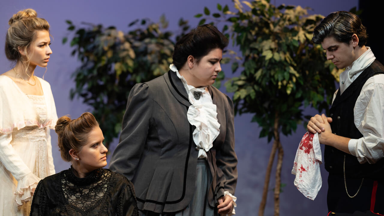 A group of 4 student actors on stage for the production, Three Sisters